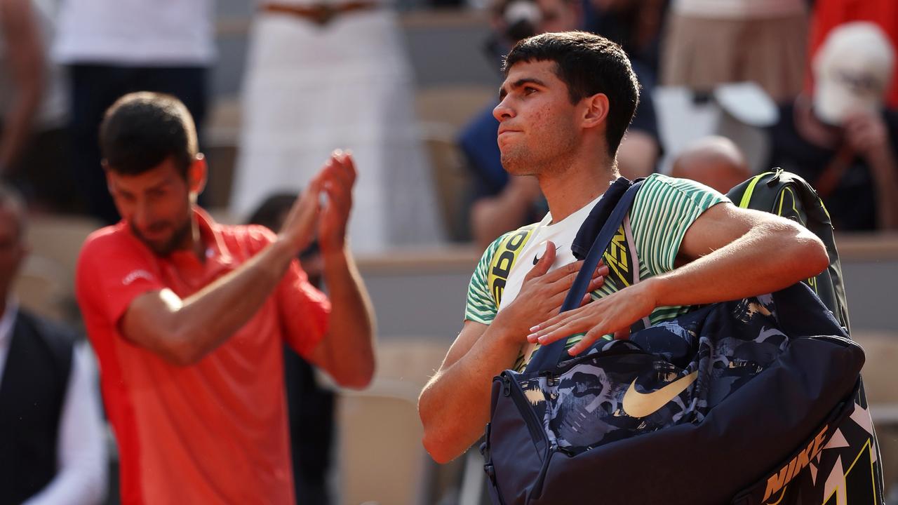 Djokovic claps as Alcaraz exits Roland Garros. (Photo by Julian Finney/Getty Images)