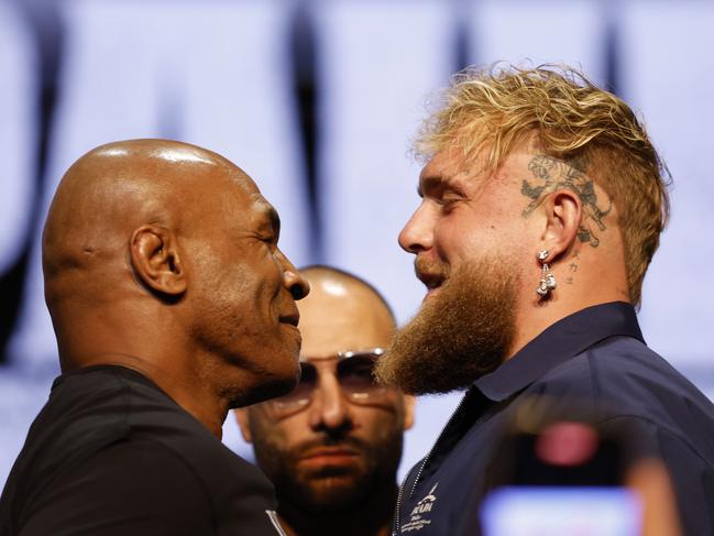 NEW YORK, NEW YORK - MAY 13: (L-R) Mike Tyson and Jake Paul speak onstage at the press conference in promotion for the upcoming Jake Paul vs. Mike Tyson boxing match at The Apollo Theater on May 13, 2024 in New York City. (Photo by Sarah Stier/Getty Images for Netflix)