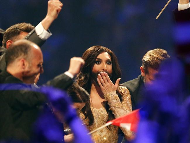 Shocked ... the singer listens as points are announced during judging at the final of the Eurovision Song Contest. Pic: Frank Augstein