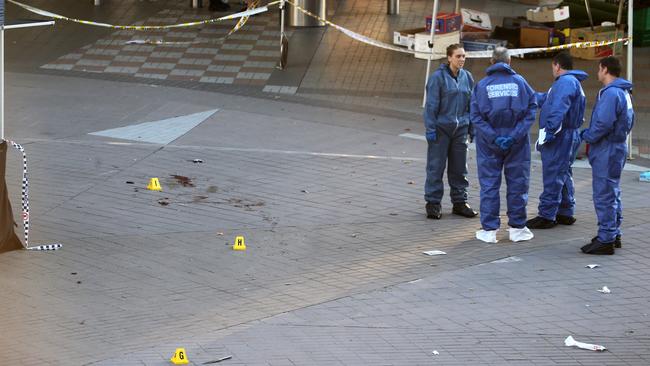 The knife and bullets marked by the forensic police in the mall of Westfield Hornsby. Pic: Stephen Cooper