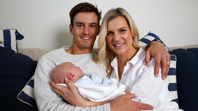 Jarryd and Savahna Lyons with their baby son Sebastian. Picture: Adam Head