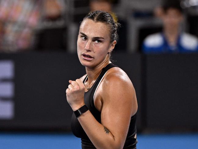 Aryna Sabalenka of Belarus celebrates after her women's singles match against Daria Kasatkina of Russia at the Brisbane International tennis tournament in Brisbane on January 5, 2024. (Photo by William WEST / AFP) / --IMAGE RESTRICTED TO EDITORIAL USE - STRICTLY NO COMMERCIAL USE--