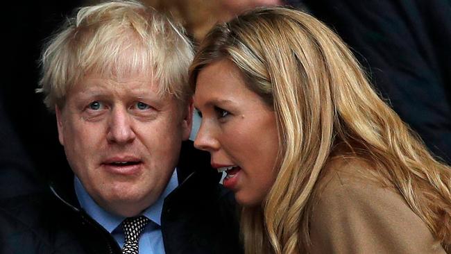 Boris Johnson and his partner Carrie Symonds attend the Six Nations international rugby union match between England and Wales at the Twickenham in March, 2020. They married the following year. Picture: Adrian Denniz/AFP