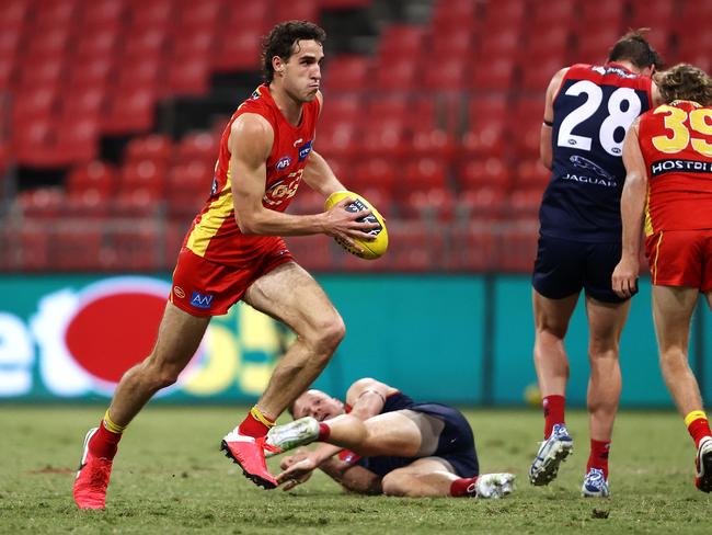 Ben King of the Suns runs the ball during the round 6 AFL match between the Melbourne Demons and the Gold Coast Suns at GIANTS Stadium on July 11, 2020 in Sydney, Australia. (Photo by Cameron Spencer/Getty Images)