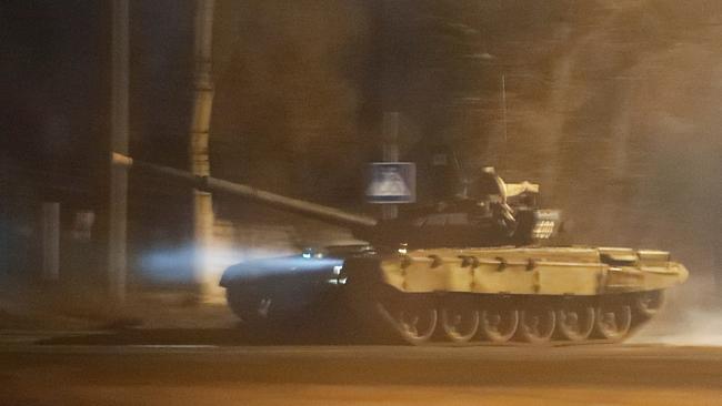 A tank drives along a street after Russian President Vladimir Putin ordered the deployment of Russian troops in the separatist-controlled city of Donetsk, Ukraine. Picture: REUTERS/Alexander Ermochenko