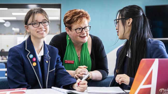 Avila College principal Michelle Cotter with students Julia Augustyn, left, and Linh Nguyen in Melbourne. Picture: Aaron Francis