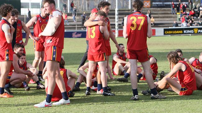 A dejected Flinders Park side after losing to Golden Grove in last season’s grand final. Picture: Emma Brasier