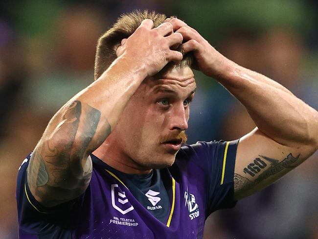 MELBOURNE, AUSTRALIA - APRIL 30:  Cameron Munster of the Storm reacts after missing a conversion during the round eight NRL match between the Melbourne Storm and the Cronulla Sharks at AAMI Park on April 30, 2021, in Melbourne, Australia. (Photo by Robert Cianflone/Getty Images)