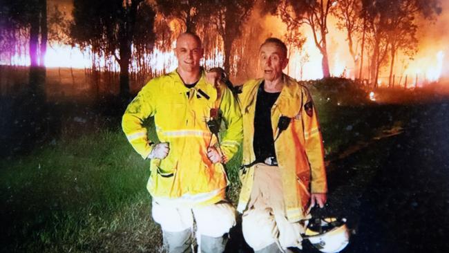 Retired firefighter John Robinson with his son on the last job.