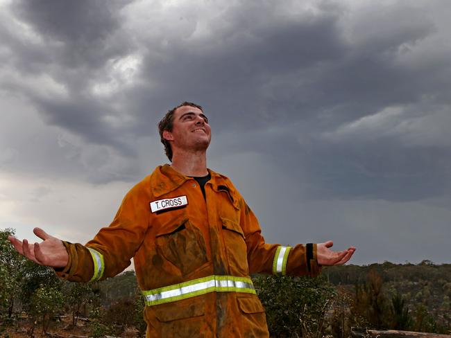 Southern Yorkes volunteer Tim Cross is thankful for the rain near One Tree Hill. Picture: Dylan Coker