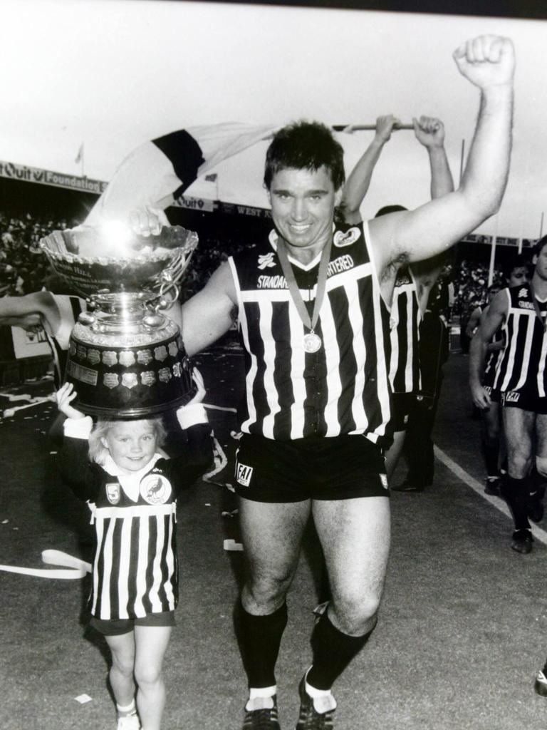 Port Adelaide legend Greg Phillips with Erin after the SANFL Premiership win at Footy Park in 1990. Picture: Phil Hillyard