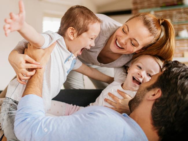 Close up of a happy young family having good time together.