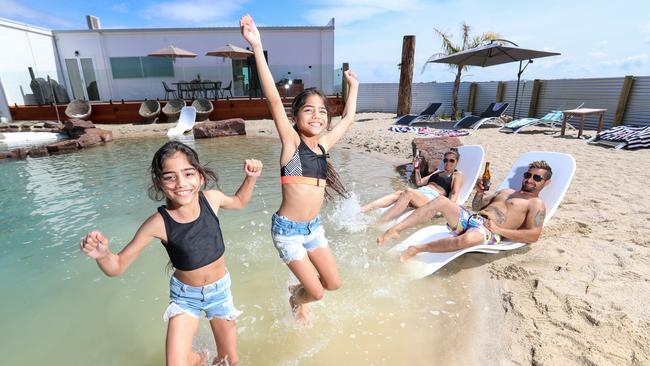 This private beach in Sunday Creek – created by Alex and Nicole Greco, who are pictured with their twin daughters, Mia and Thalia – features in one of Victoria’s best backyards. Picture: Alex Coppel