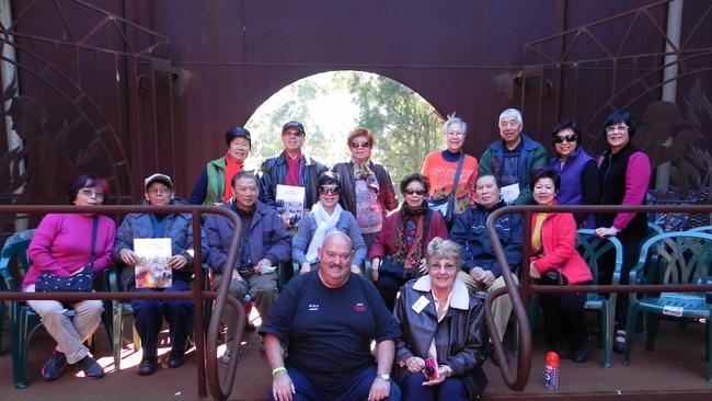 Mr Brooks (front left) taking visitors through the BHP muster point. Supplied.