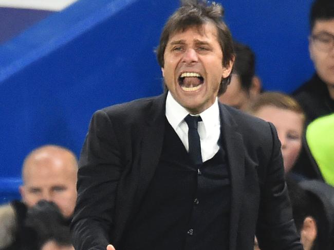 Chelsea's Italian head coach Antonio Conte gestures from the touchline during the English Premier League football match between Chelsea and Bournemouth at Stamford Bridge in London on December 26, 2016. / AFP PHOTO / Glyn KIRK / RESTRICTED TO EDITORIAL USE. No use with unauthorized audio, video, data, fixture lists, club/league logos or 'live' services. Online in-match use limited to 75 images, no video emulation. No use in betting, games or single club/league/player publications. /