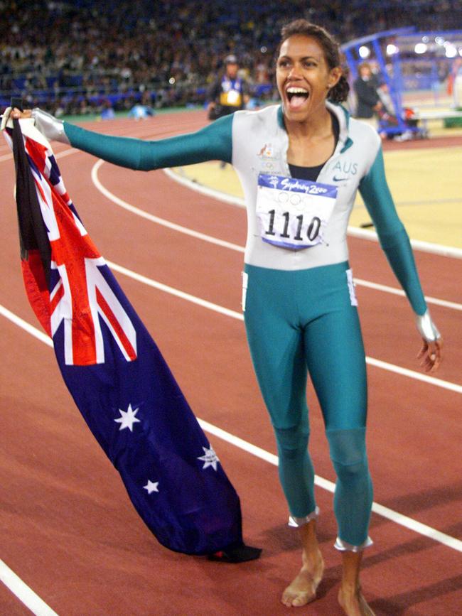 Cathy Freeman celebrates after winning the women’s 400m gold medal at the Sydney Olympics in 2000. Picture: File