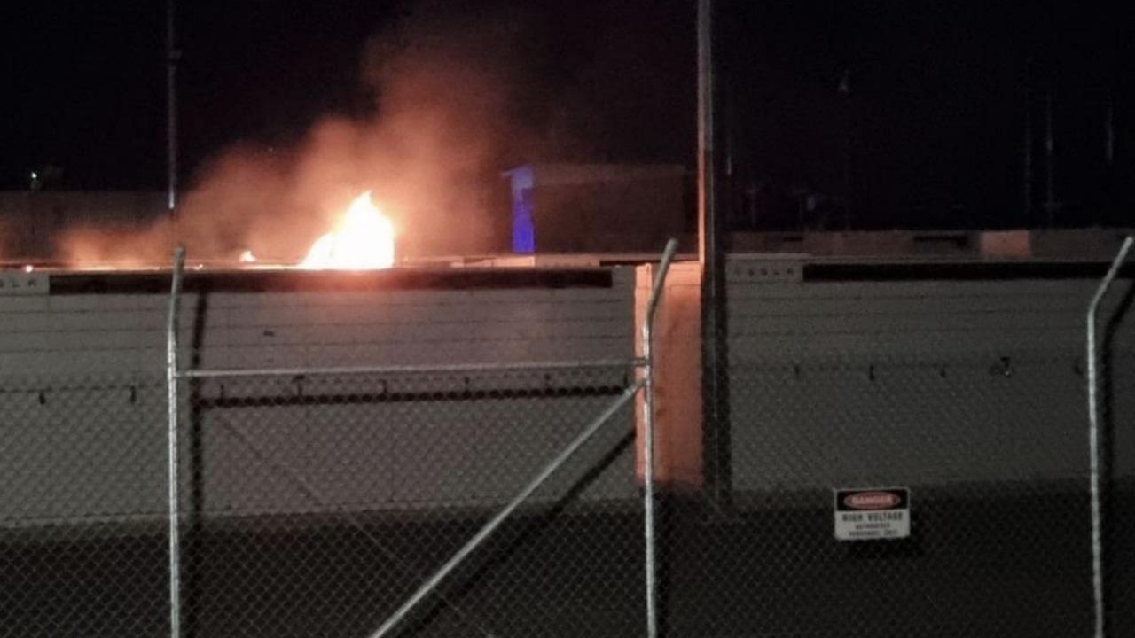 A fire rages in a battery storage bank at a power substation at Bouldercombe near Rockhampton.