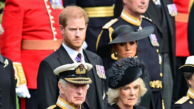 Prince Harry, Duke of Sussex, Meghan, Duchess of Sussex, King Charles III and Camilla, Queen Consort watch the coffin of Queen Elizabeth II as it is transferred to a hearse at Wellington Arch following a state funeral at Westminster Abbey on September 19, 2022 in London. Picture: Andy Stenning - WPA Pool/Getty Images