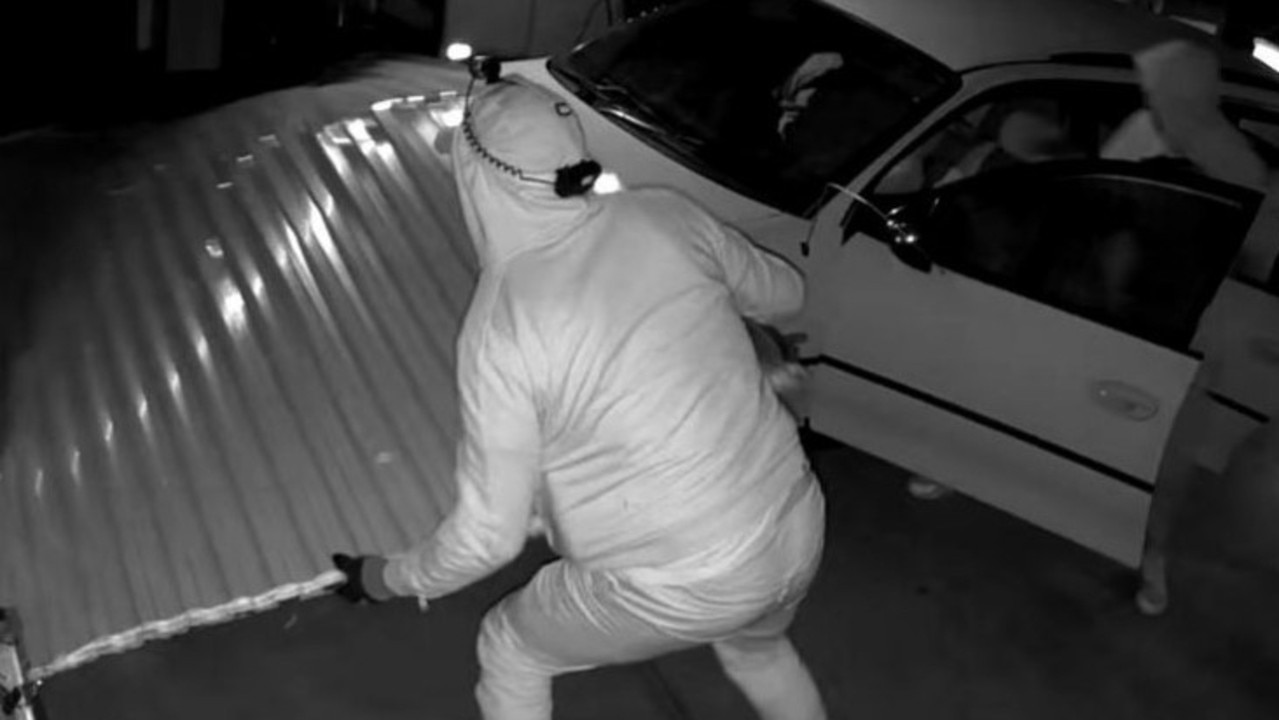 Bizarre ram raid images spark search for men