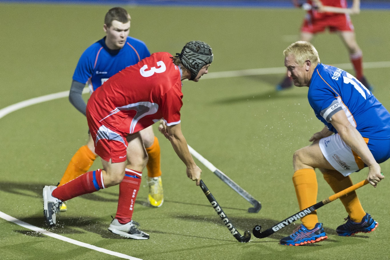 Red Lion Lachlan Brownhalls (centre) evades Matt Siebuhr of Newtown in Toowoomba Hockey COVID Cup men round four at Clyde Park, Friday, July 31, 2020. Picture: Kevin Farmer