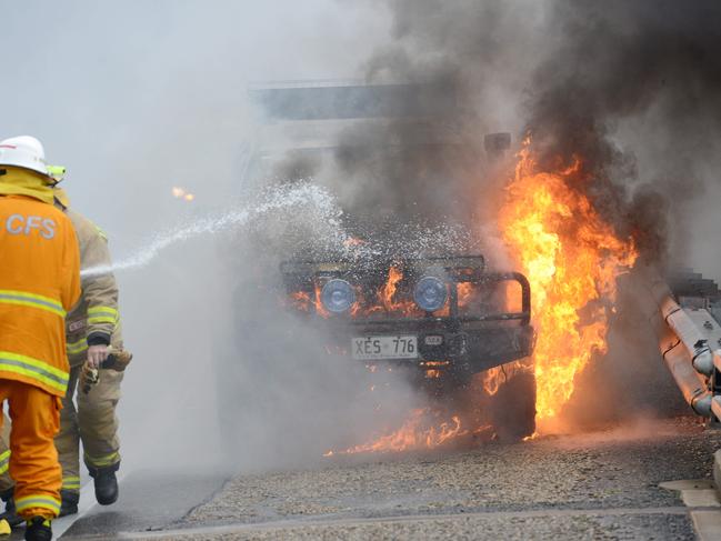 A Holden Jackaroo on fire on the Stirling overpass section of the S E Freeway downtrack, Thursday, July 11, 2019. (Pic: Brenton Edwards)