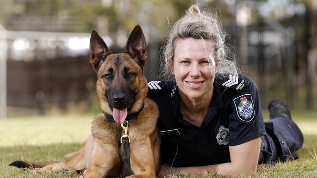 Sergeant Jaye Lilley, with Echo, at the police dog squad training facility in Brisbane. Picture: Josh Woning