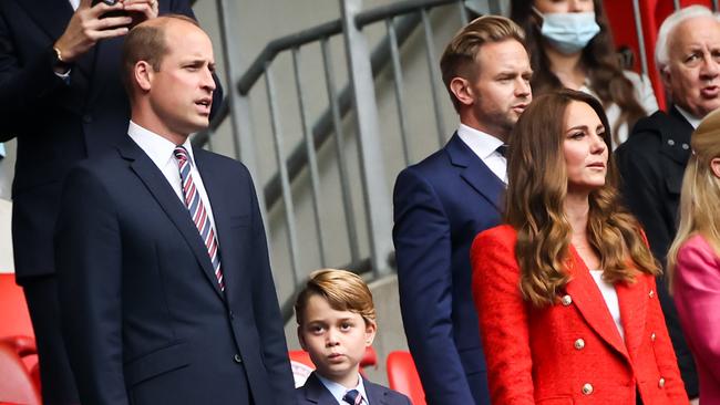 The British Prince William, Duchess of Cambridge Kate Middleton, and their son Prince George watch the Euros.