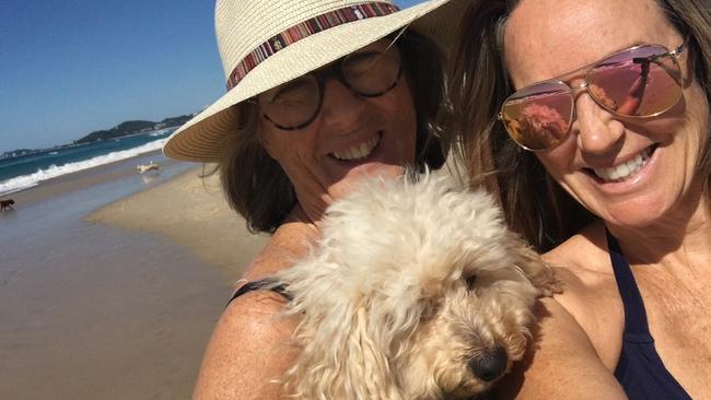 Ollie Oscar the 11-year-old moodle with his owner Keelie Hartigan (R) and her mother. Picture: supplied