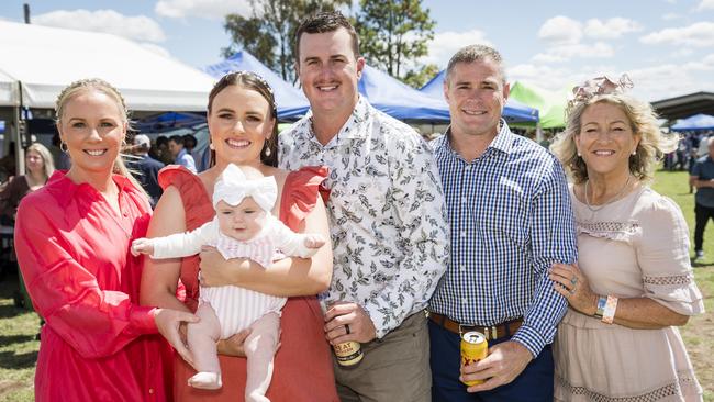 At the Clifton Races are (from left) Kristal Burns, Meg Gardner holding Reevie Gardner, Ty Gardner, Travis Burns and Mandy Burns, Saturday, October 28, 2023. Picture: Kevin Farmer