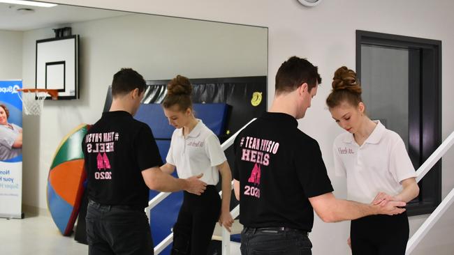 One step at a time … Mackenzie Lawler with her physiotherapist Tim McGowan.