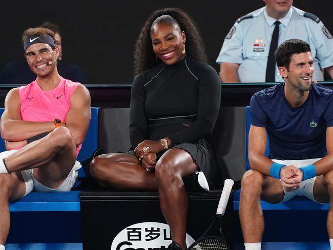 Rafael Nadal of Spain, Serena Williams of the United States andf Novak Djokovic of Serbia look on during the Rally For Relief at Rod Laver Arena in Melbourne, Wednesday, January 15, 2020. Tennis stars have come together for the Rally for Relief at Rod Laver Arena in Melbourne to raise money in aid of the bushfire relief efforts across Australia. (AAP Image/Scott Barbour) NO ARCHIVING