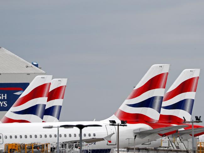 British Airways passenger planes are pictured at the apron at London Heathrow Airport in west London. Picture: Adrian Dennis / AFP.