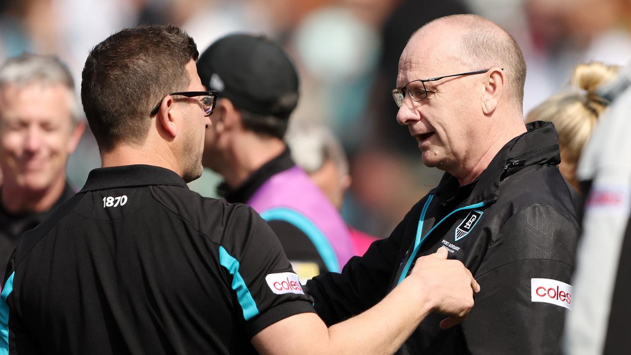 ADELAIDE, AUSTRALIA - AUGUST 27: Josh Carr, Midfield Coach of the Power talks to Ken Hinkley, Senior Coach of the Power at quarter time during the 2023 AFL Round 24 match between the Port Adelaide Power and the Richmond Tigers at Adelaide Oval on August 27, 2023 in Adelaide, Australia. (Photo by Sarah Reed/AFL Photos via Getty Images)