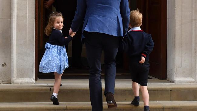 Charlotte and George are led by their father to visit their mother. Picture: AFP