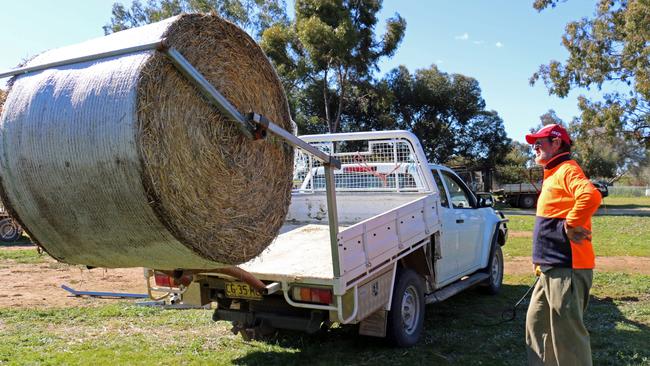 Easy loading: Peter Mills shows off his hay bale loader.