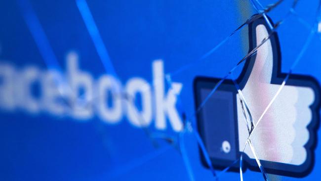 Facebook’s logo on a broken screen of a mobile phone. Picture: AFP