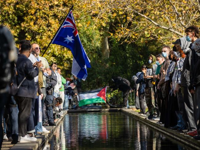 Jewish Israel supporters gather in a park near Melbourne University then walk into the university and face off with Pro Palestine protesters. Picture: Jason Edwards