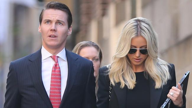 Oliver Curtis and wife Roxy Jacenko arrive at the NSW Supreme Court yesterday. Picture: John Grainger