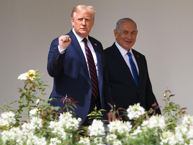 (FILES) In this file photo taken on September 15, 2020, US President Donald Trump arrives with Israeli Prime Minister Benjamin Netanyahu(R) before Bahraini and Emirati Foreign Ministers, to participate in the signing of the Abraham Accords where the countries of Bahrain and the United Arab Emirates recognize Israel, on the South Lawn of the White House in Washington, DC. - Joe Biden's election marks a setback for Israeli premier Benjamin Netanyahu, a staunch ally of President Donald Trump, but could spur renewed engagement between Washington and the Palestinians, experts said. (Photo by SAUL LOEB / AFP)