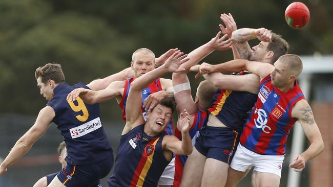 A marking contest in the Caulfield-Springvale Districts clash. Picture: Valeriu Campan