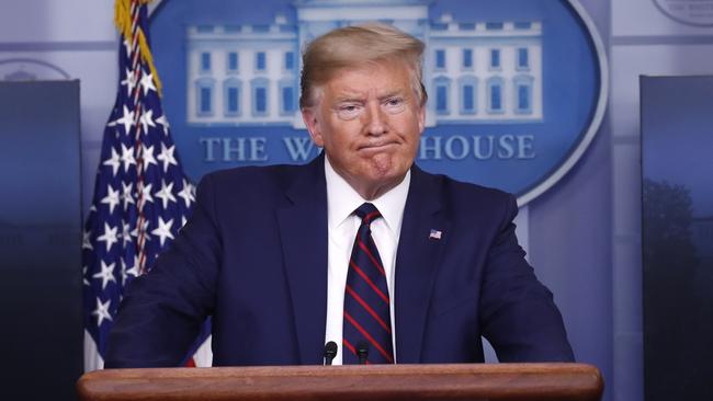 President Donald Trump pauses as he speaks about the coronavirus in the James Brady Press Briefing Room of the White House.