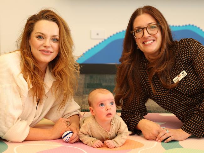 Madison Papas with 11 week old Goldie and midwife Serena Pellizzeri from NEST debrief services. Picture: Alison Wynd