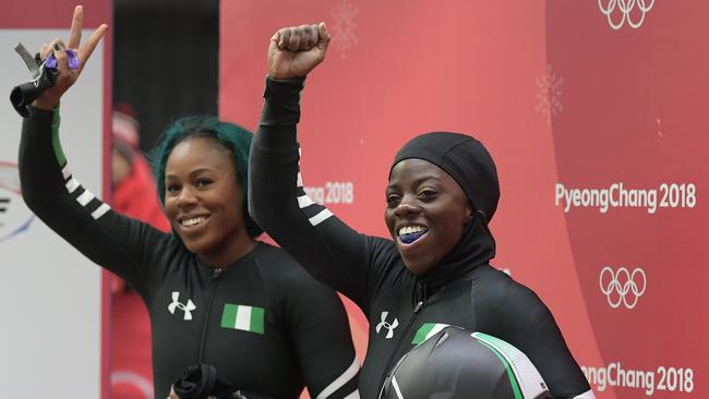 Nigeria's Moriam Seun Adigun (right) and Akuoma Omeoga wave after the second heat of the women's bobsleigh. Photo: AFP