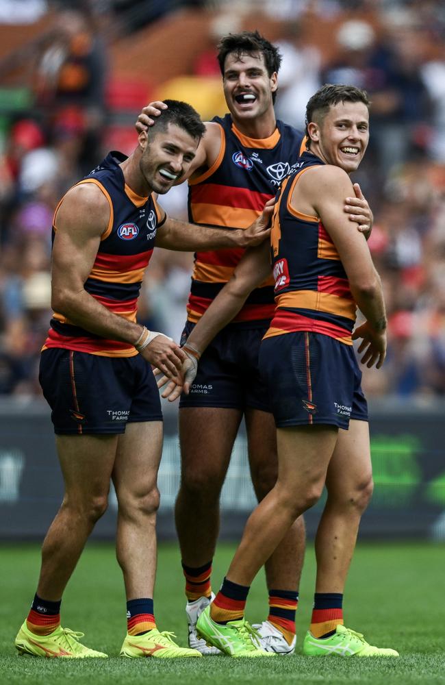 Jake Soligo celebrates a goal with Alex Neal-Bullen and Darcy Fogarty during their win over St Kilda. Picture: Mark Brake/Getty Images.