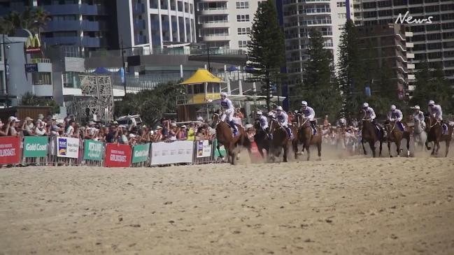 Hugh Bowman and jockeys race along the Gold Coast