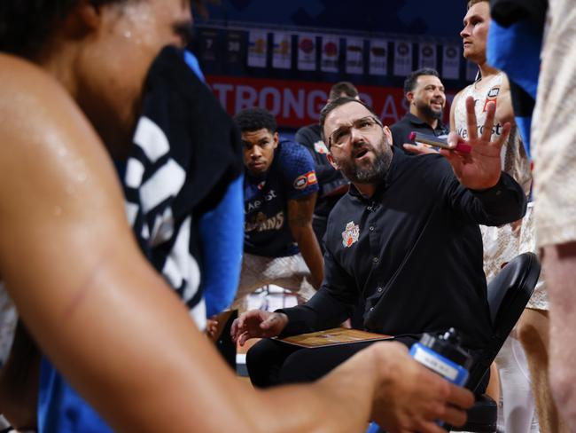 Adam Forde Head Coach of the Taipans talks to his players during a timeout during the round 18 NBL match between Perth Wildcats and Cairns Taipans at RAC Arena, on January 25, 2025, in Perth, Australia. (Photo by James Worsfold/Getty Images)