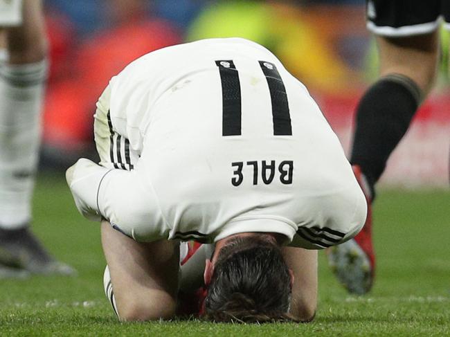 Real midfielder Gareth Bale reacts on the ground during the Champions League soccer match between Real Madrid and Ajax at the Santiago Bernabeu stadium in Madrid, Spain, Tuesday, March 5, 2019. (AP Photo/Manu Fernandez)