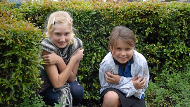 Shivering in the shrubbery are Joely Adamik and Acacia Scammell. Picture: Donna Jones