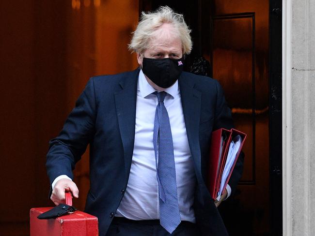 Britain's Prime Minister Boris Johnson, wearing a protective face covering to combat the spread of coronavirus. Picture: AFP