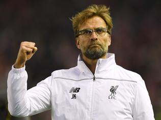 LIVERPOOL, ENGLAND - APRIL 14: Jurgen Klopp, manager of Liverpool celebrates victory after the UEFA Europa League quarter final, second leg match between Liverpool and Borussia Dortmund at Anfield on April 14, 2016 in Liverpool, United Kingdom. (Photo by Shaun Botterill/Getty Images)